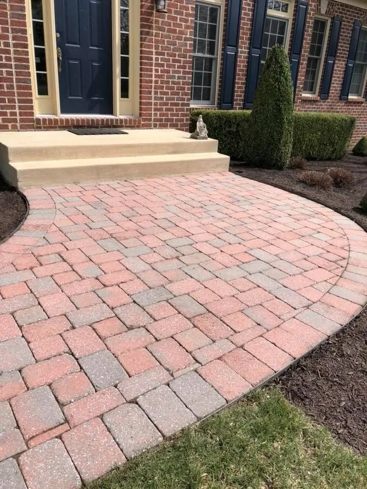 Curved brick walkway leading to porch